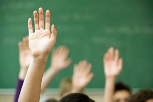 Students raising their hands